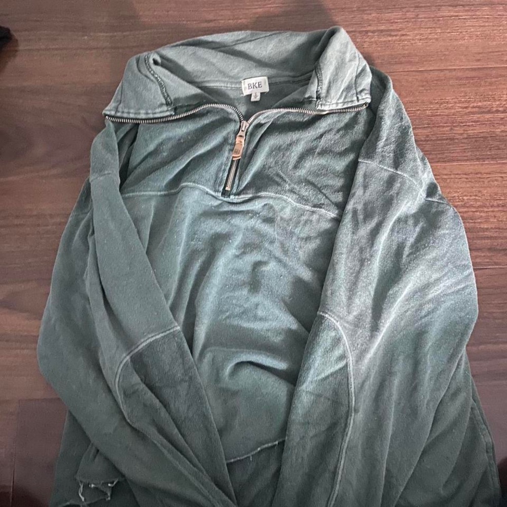 Distressed green patched towel material quarter zip